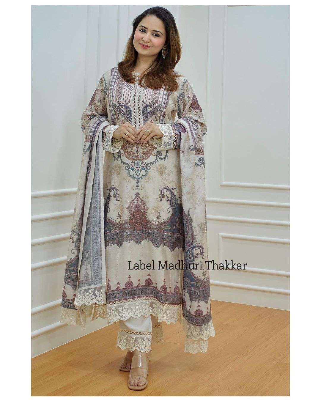 pakistani suit which is beautifully decorated with digital prints sequince embroidery and lace detailings allover readymade pure muslin readymade paksitani dress top bottom and pant ivory colour