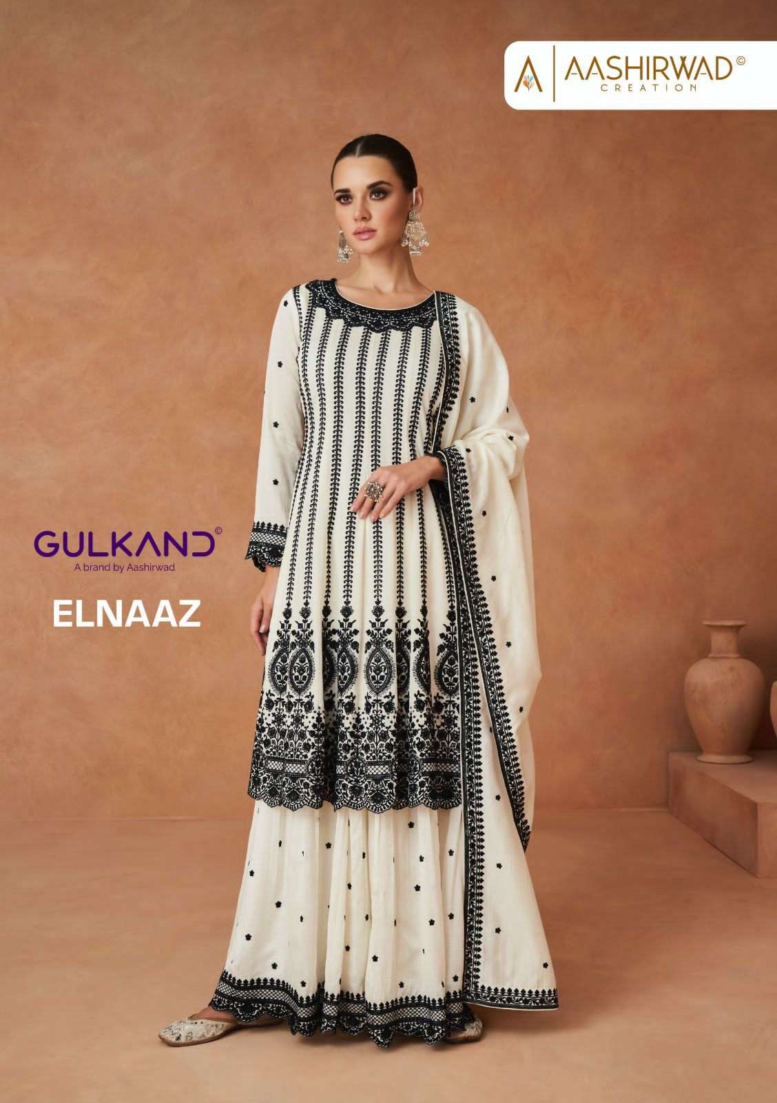   aashirwaad creation catalogue elnaaz series 9822 to 9823 black and white colour heavy partywear catalogue brand suit collection 