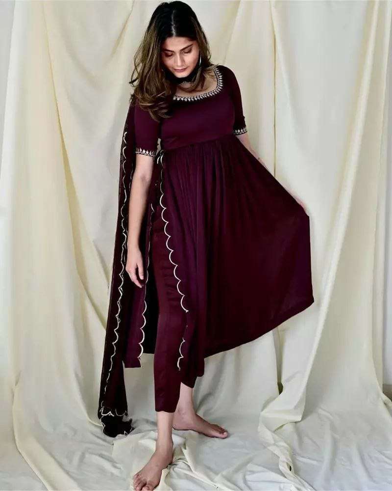 wine chiffon nyra cut dress morpeach chiffon nyra cut dress look bold and beautiful this festive season with this beautiful chiffon nyra cut  suit the embroidery cut work details add the elegance to the dress