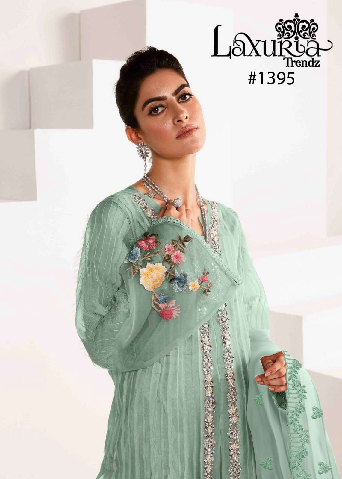 laxuria trendz design number 1395 a sophisticated yet elegant on  pastel green shade enhanced with intricate long shirt embroidered front n floral decorated with handwork tunic