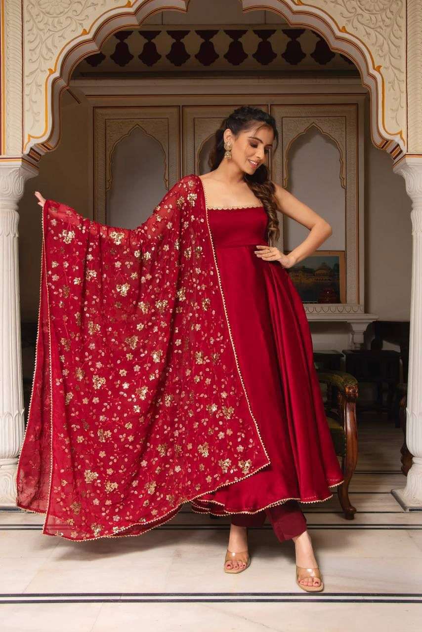 867 red sana suit ravishing red draped in glamour our anarkali suit set is a dance of tradition and modern allure perfect for a wedding guest who loves to make a statement