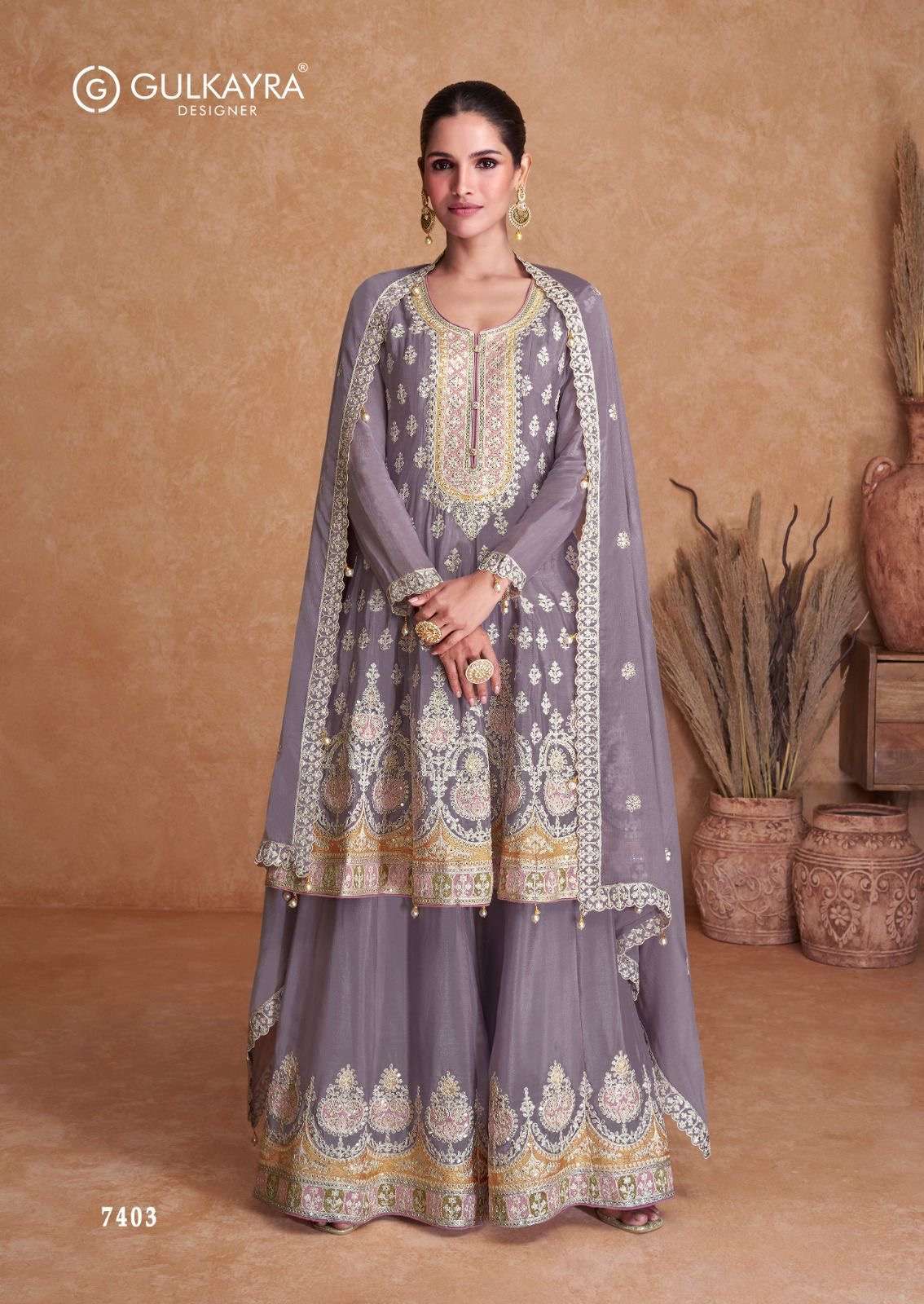 gulkayra designer catalogue flory top real chinon front n back work dupatta real chinon bottom real chinon front n back work note free size singles available readymade suit