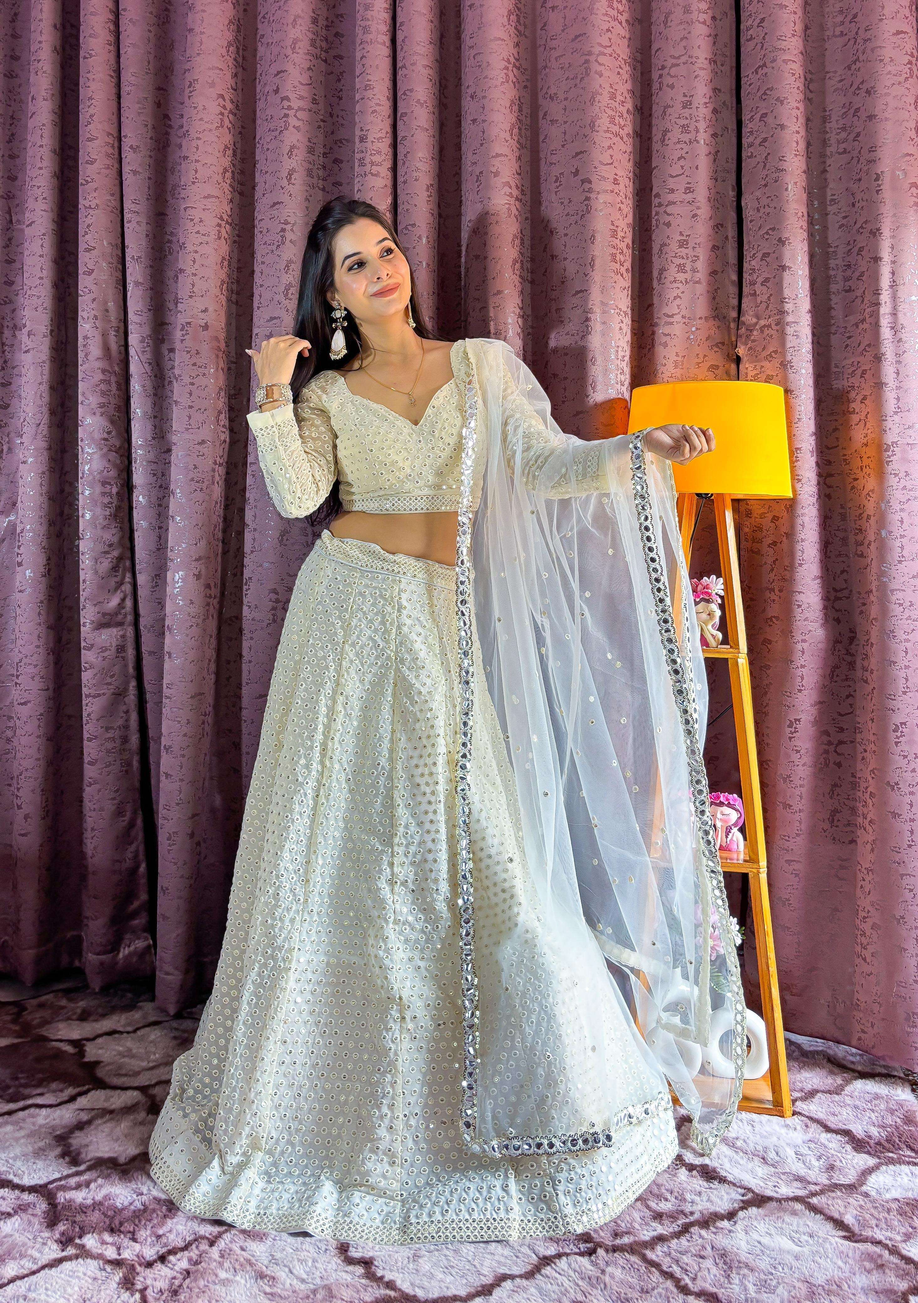 look drop dead gorgeous in this beautiful off white lehenga set code fb h80 fabric georgette lehenga with sequins n thread work designer partywear heavy lehenga