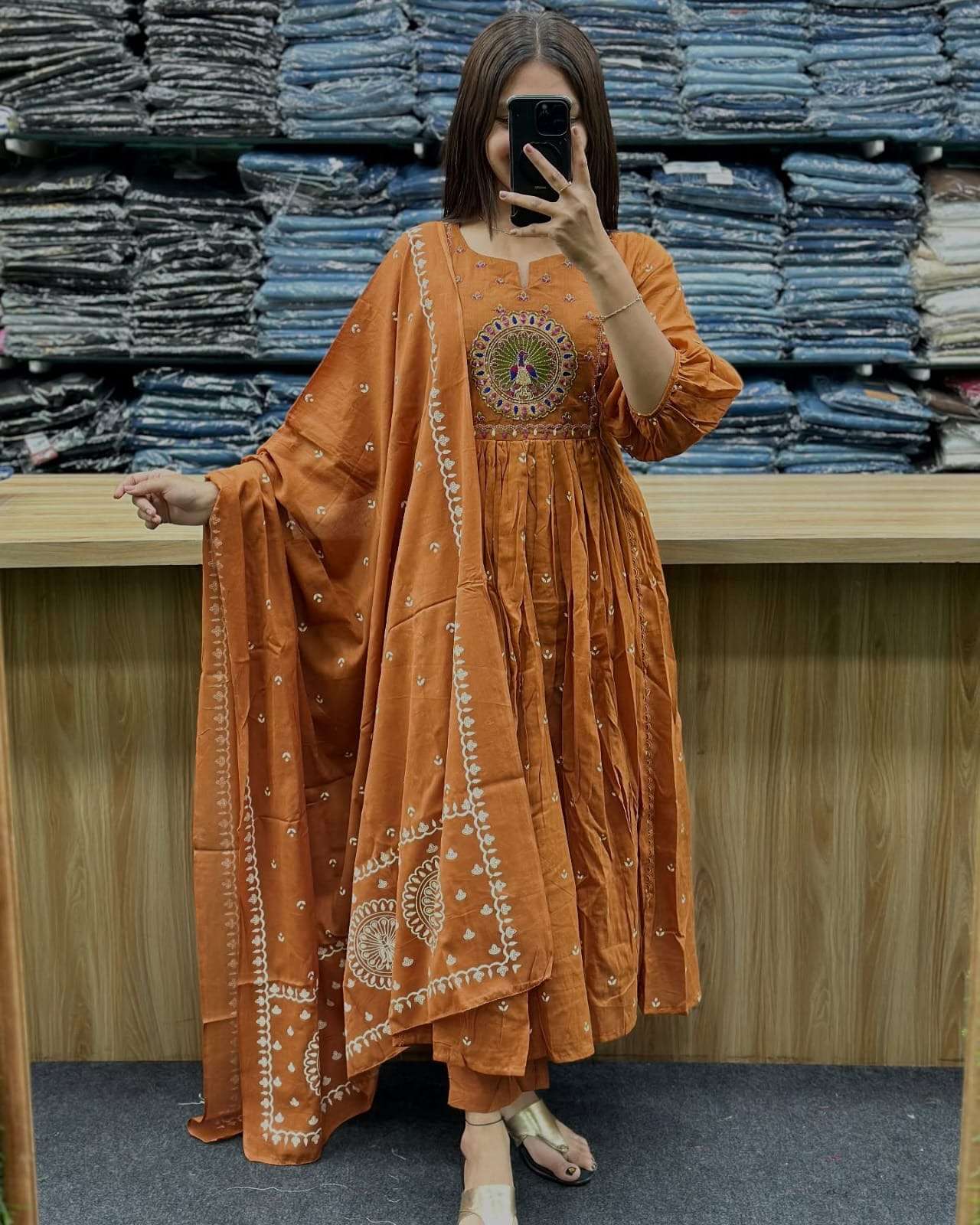 orange mal cotton kurti pant dupatta set elegant orange kurti set this stylish kurti pant dupatta set features a vibrant orange kurtie with round butta detailing on the yoke and a flattering pleated design